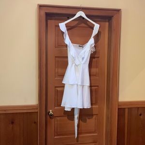 White BooHoo ruffle sleeve tie waist dress